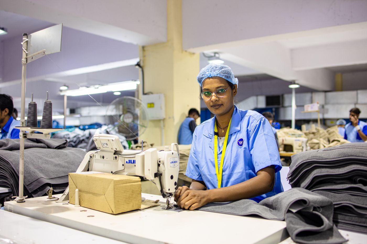 Operator at an industrial sewing station