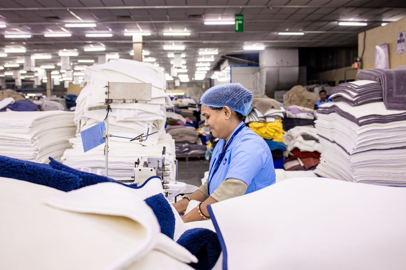 Fabric stacked on a garment production floor